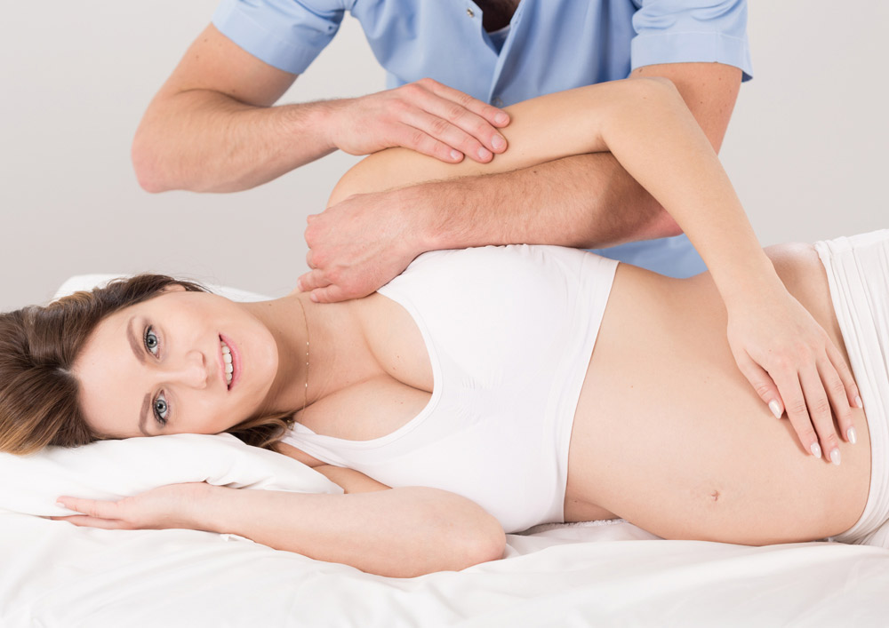 chiropractor with pregnant woman